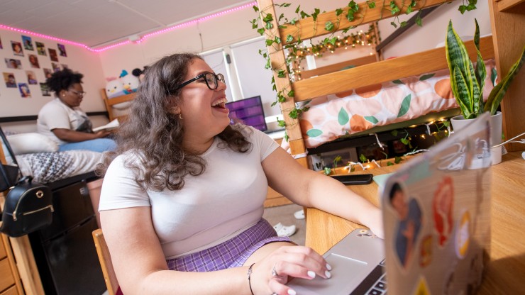 Roommates laugh together in Brown Hall.